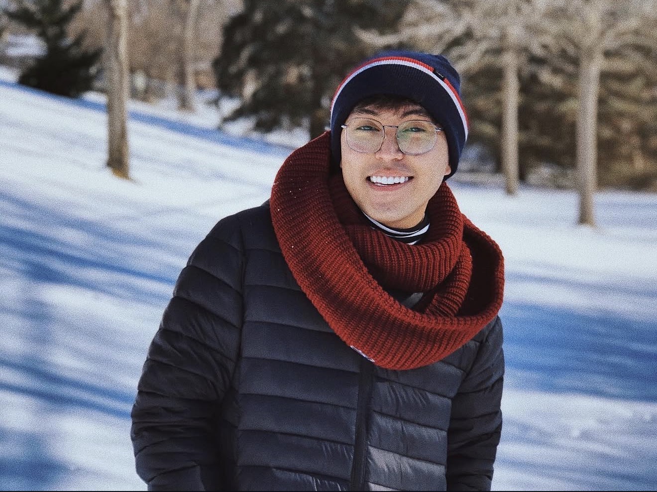 Ryan V. Visith outdoors in a snowy landscape, representing personal journey, reflection, and lived experience.
